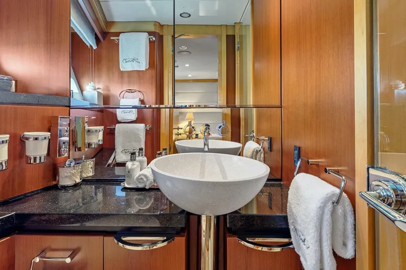 Slide: The Image of Luxurious bathroom on 2005 New Zealand Yachts 115 Wave Piercer, featuring elegant fixtures and wood accents. - 58