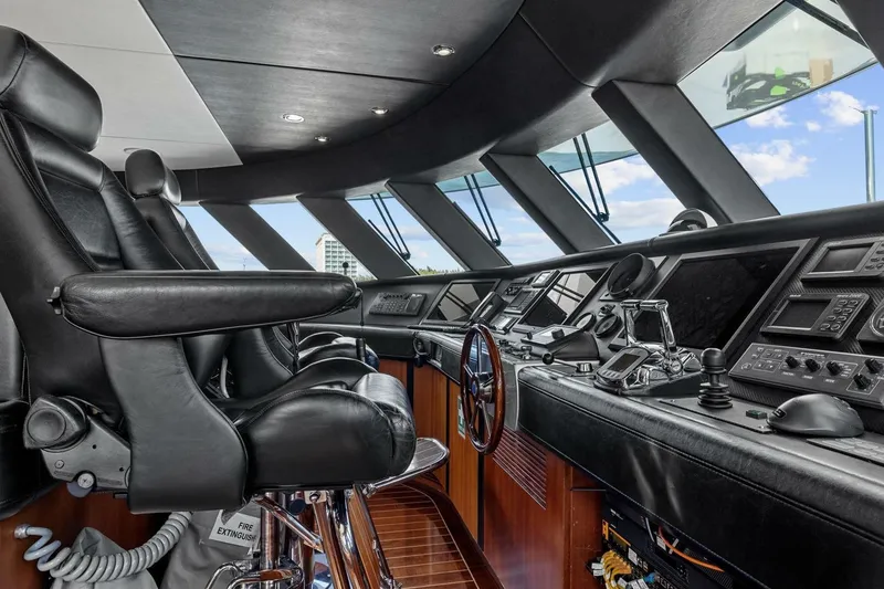 Slide: The Image of Luxurious helm of 2005 New Zealand Yachts 115 Wave Piercer with leather seating and advanced controls. - 64