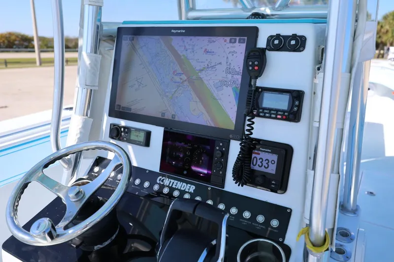 Slide: The Image of Control panel of a 2003 Contender 36 Open boat with navigation equipment. - 16