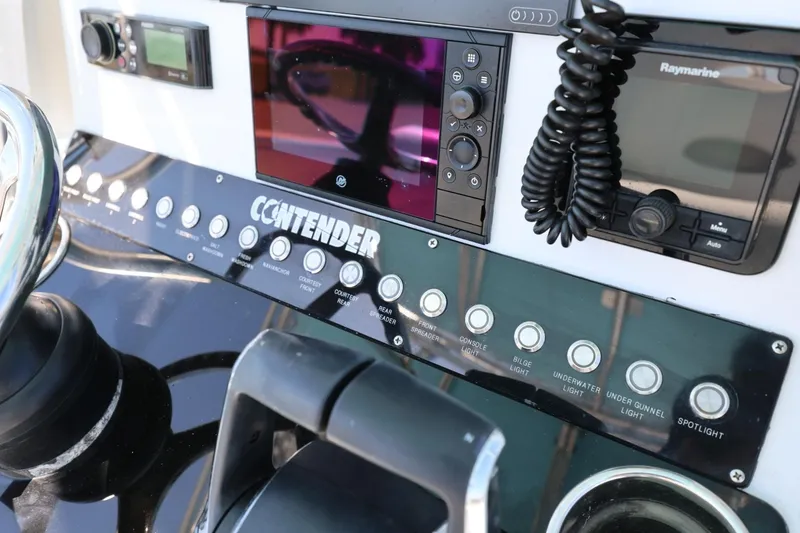 Slide: The Image of Control panel of a 2003 Contender 36 Open boat with navigation equipment. - 19