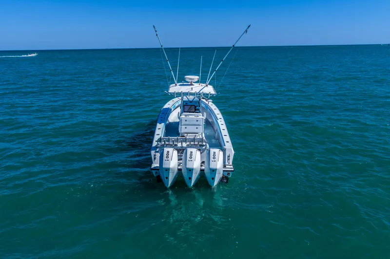 Slide: The Image of 2003 Contender 36 Open boat with triple engines on open sea. - 3