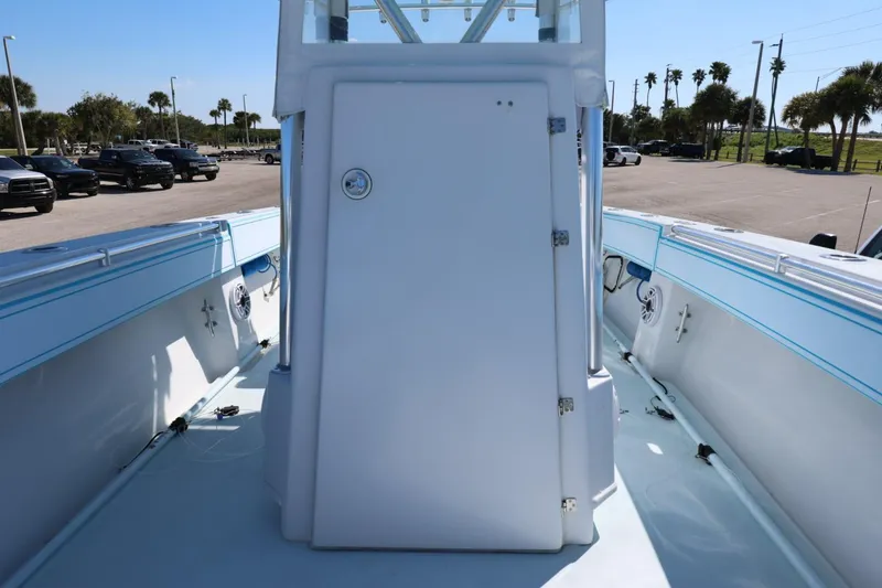 Slide: The Image of 2003 Contender 36 Open boat interior with white console and blue accents. - 30