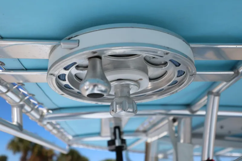 Slide: The Image of Close-up of a 2003 Contender 36 Open boat's overhead reel holder. - 32