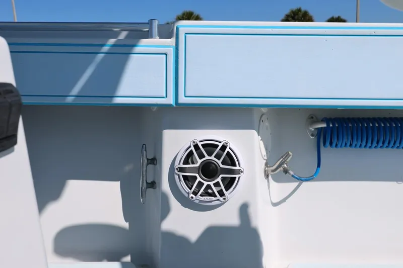 Slide: The Image of 2003 Contender 36 Open boat interior with speaker and coiled blue hose. - 33