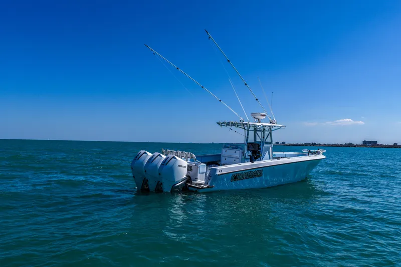 Slide: The Image of 2003 Contender 36 Open boat on blue ocean under clear sky. - 39