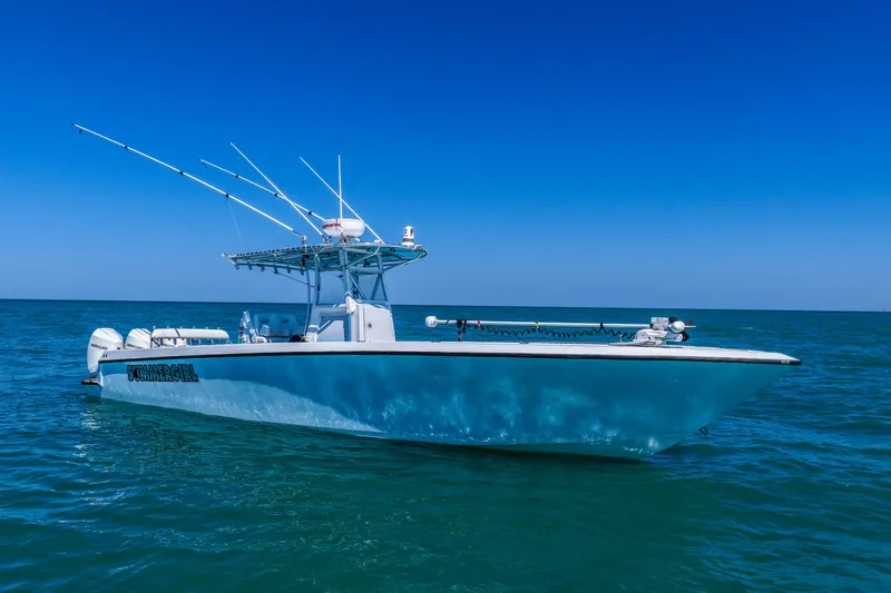 Slide: The Image of 2003 Contender 36 Open boat on calm ocean under clear blue sky. - 42