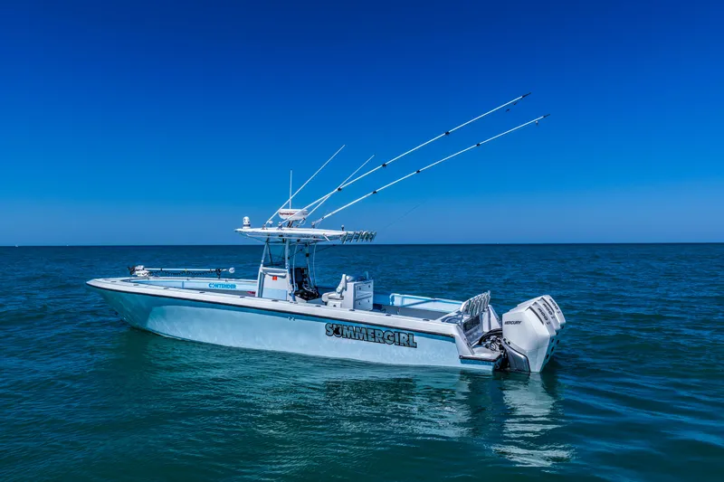 Slide: The Image of 2003 Contender 36 Open boat on calm ocean under clear blue sky. - 45