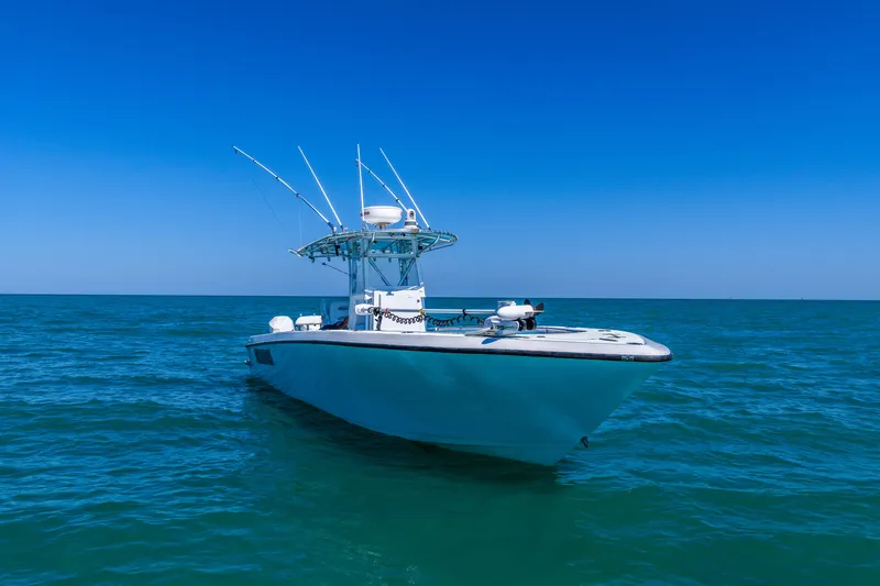 Slide: The Image of 2003 Contender 36 Open boat on calm ocean under clear blue sky. - 48