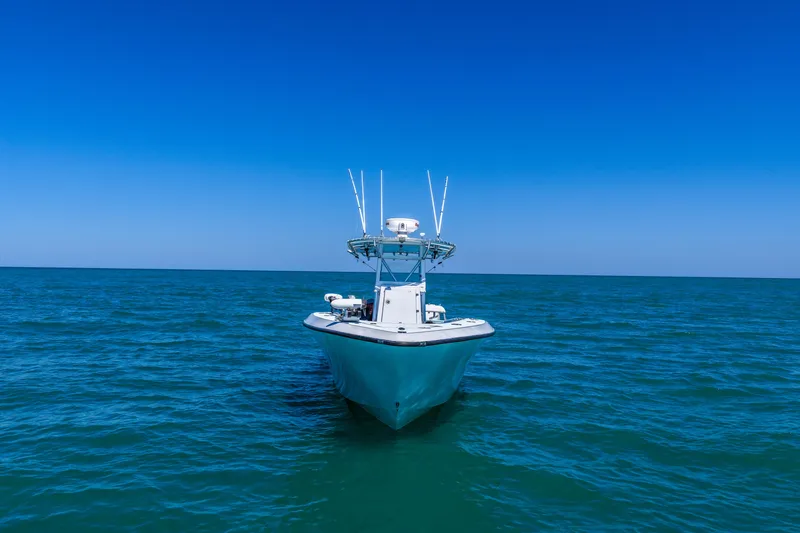 Slide: The Image of 2003 Contender 36 Open boat on open sea under clear blue sky. - 6
