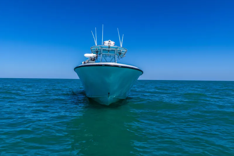 Slide: The Image of 2003 Contender 36 Open boat on open sea under clear blue sky. - 8