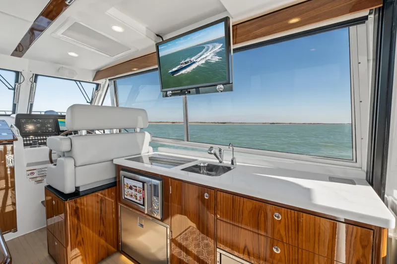 Slide: The Image of Luxurious interior of 2026 MJM 47 R yacht with modern amenities and ocean view. - 15