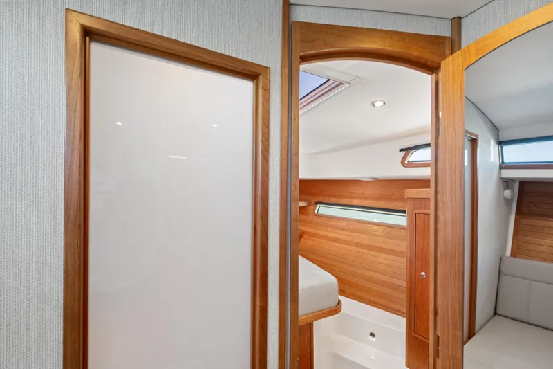 Slide: The Image of Interior of 2026 MJM 47 R yacht with wooden paneling and modern design. - 23