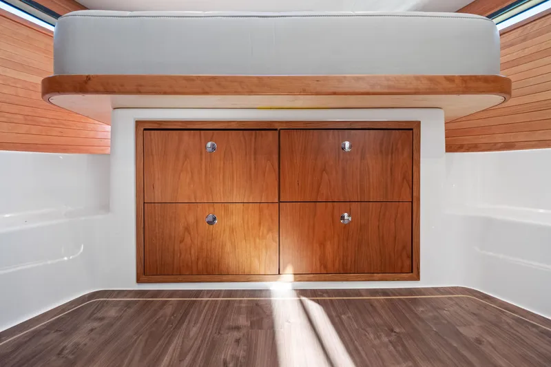 Slide: The Image of Interior of 2026 MJM 47 R yacht with wooden cabinetry and modern design. - 27