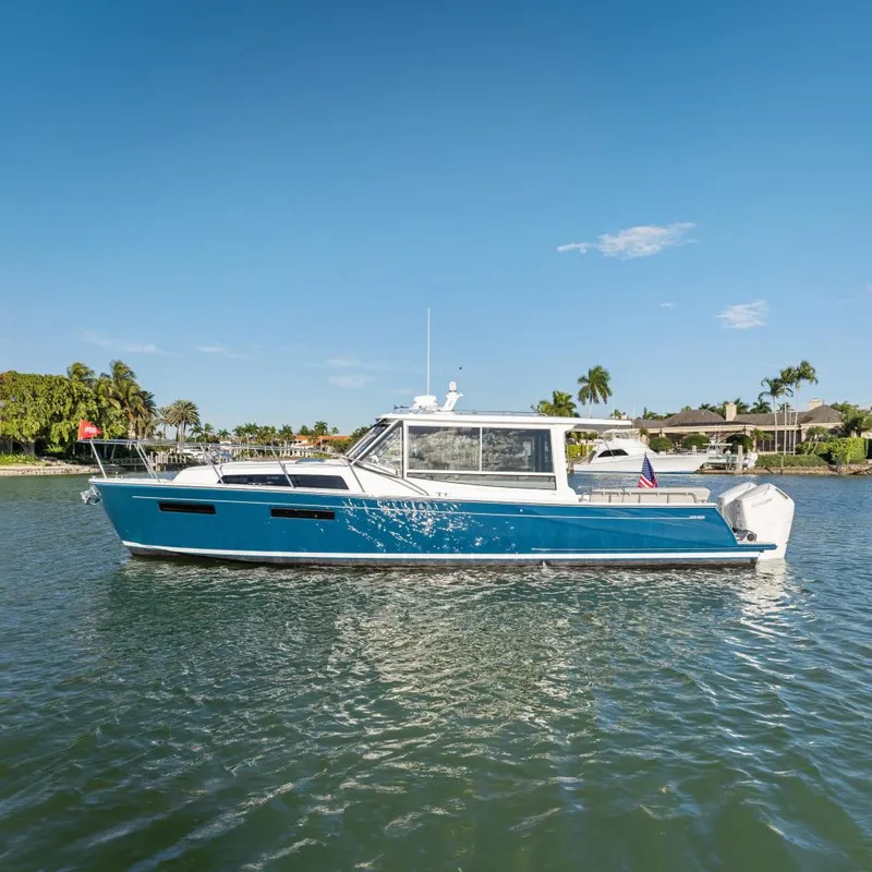 Slide: The Image of MJM 47 R 2026 yacht on calm water under sunny skies. - 42
