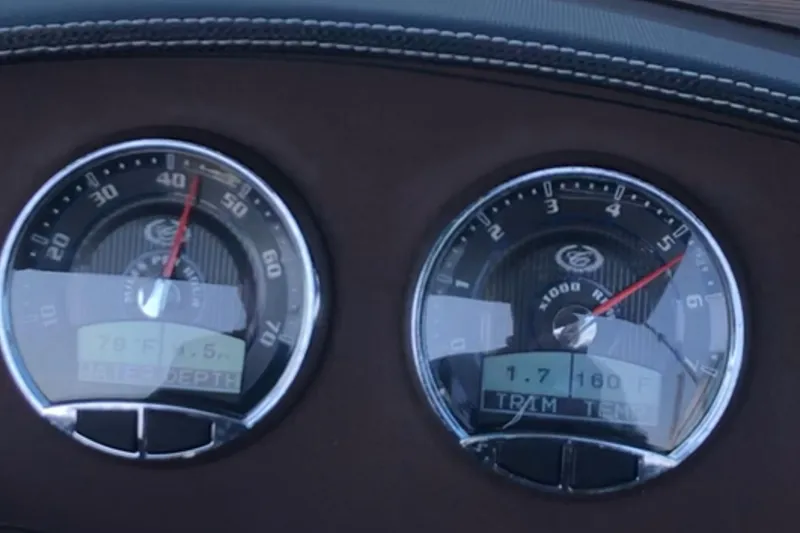 Slide: The Image of Dashboard gauges of a 2016 Cobalt R5 boat, displaying speed and engine metrics. - 5