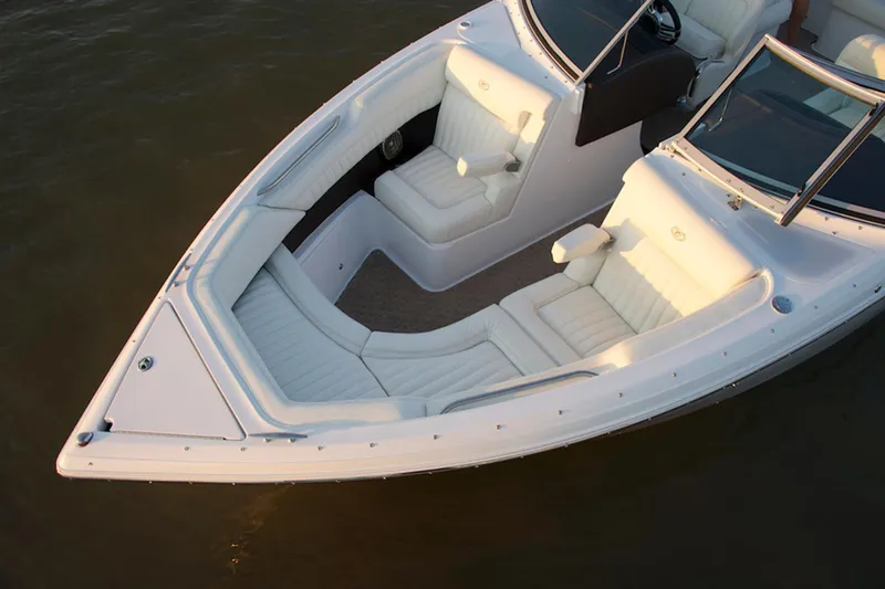 Slide: The Image of Manufacturer Provided Image: 2016 Cobalt R5 boat with white leather seating on water. - 7