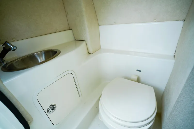 Slide: The Image of Compact bathroom in 2010 Sea Ray 270 SLX boat with sink and toilet. - 21