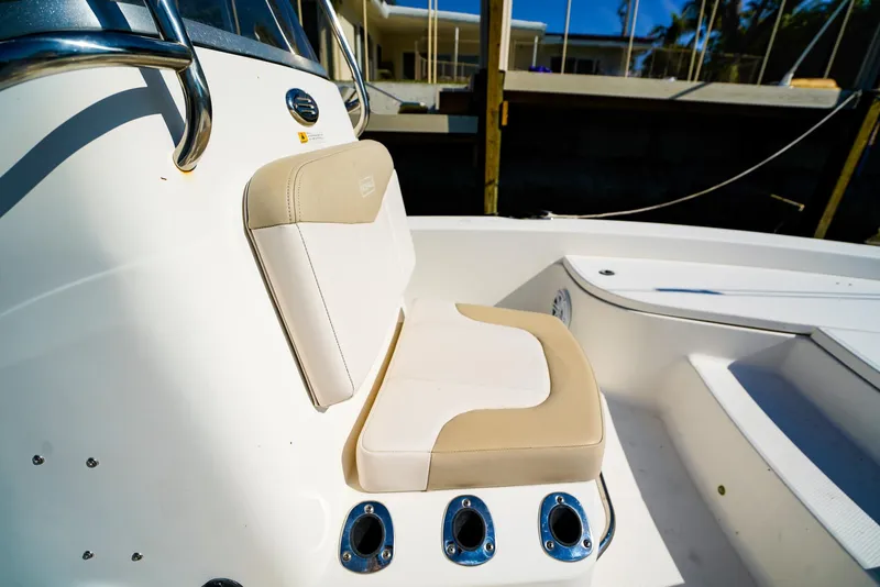 Slide: The Image of 2016 Robalo 206 Cayman boat seat with beige and white upholstery. - 7