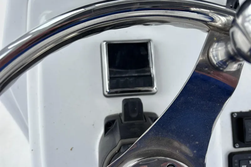 Slide: The Image of Steering wheel of 2021 Sportsman Open 252 Center Console boat. - 18