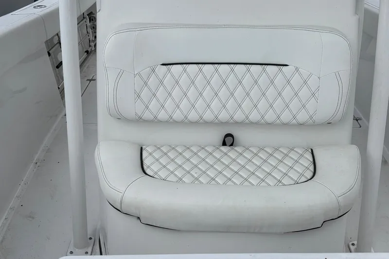 Slide: The Image of White cushioned seating on 2021 Sportsman Open 252 Center Console boat. - 22