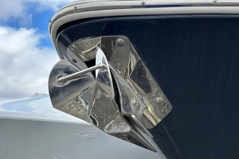 Slide: The Image of Close-up of a 2021 Sportsman Open 252 Center Console boat anchor against a blue sky. - 4