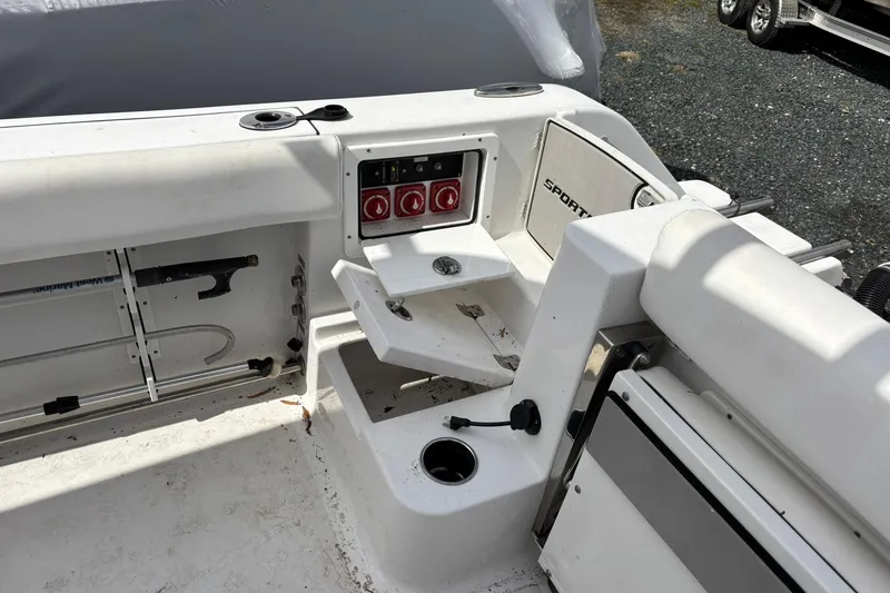 Slide: The Image of 2021 Sportsman Open 252 Center Console boat interior with seating and control panel. - 5