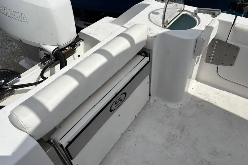 Slide: The Image of 2021 Sportsman Open 252 Center Console boat interior with Yamaha engine and seating. - 6