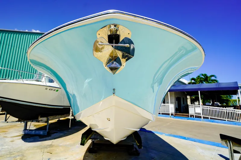 Slide: The Image of 2021 Tidewater 256 LXF boat on display under clear blue sky. - 27