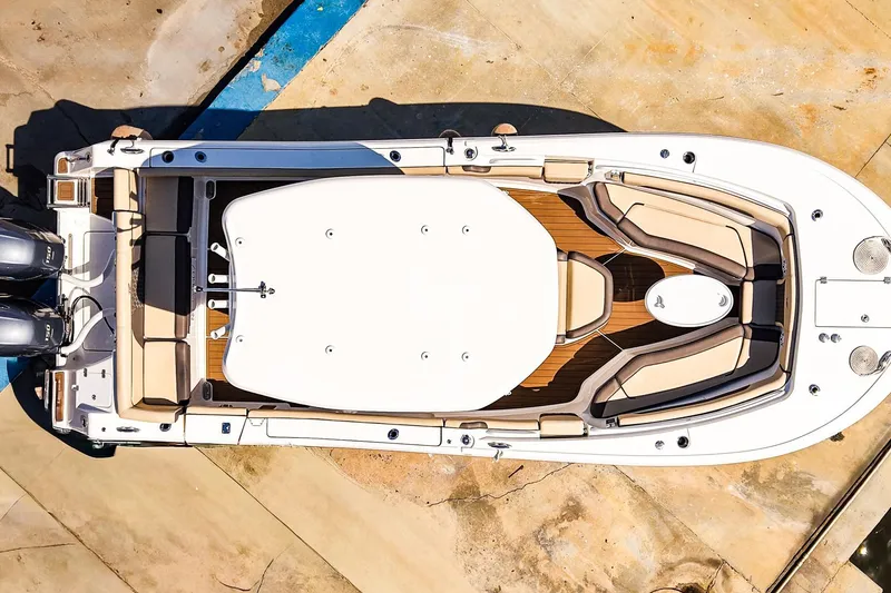 Slide: The Image of Overhead view of a 2021 Tidewater 256 LXF boat with dual engines and spacious seating. - 3