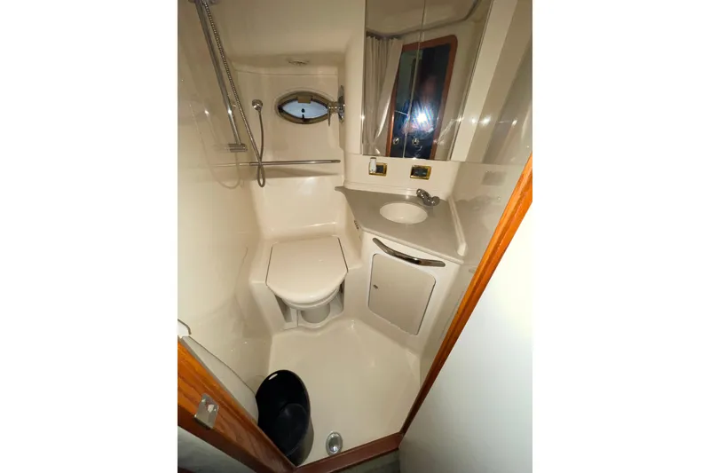 Slide: The Image of Bathroom interior of 2001 Sea Ray Sundancer 460 yacht, featuring shower and sink. - 23