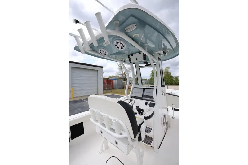 Slide: The Image of 2023 Tidewater 232 SS boat cockpit with modern controls and overhead rod holders. - 10