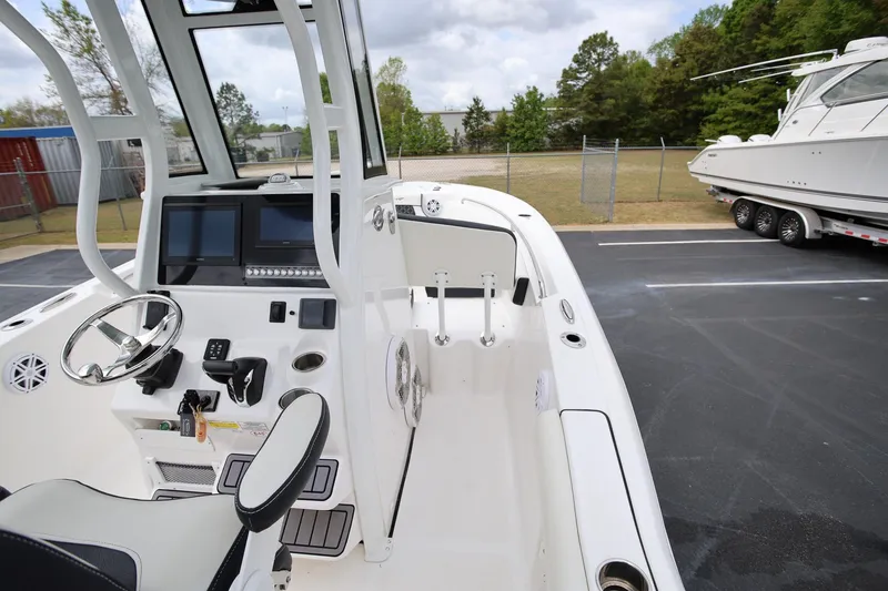 Slide: The Image of 2023 Tidewater 232 SS boat interior with steering wheel and control panel. - 22