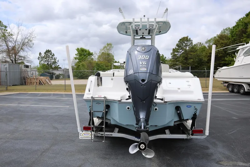 Slide: The Image of 2023 Tidewater 232 SS boat with Yamaha 300 V6 engine, parked outdoors. - 3