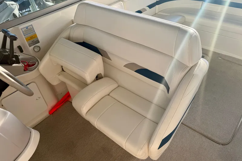 Slide: The Image of Interior seating of a 2000 Formula 280 Bowrider boat, featuring white upholstery. - 15