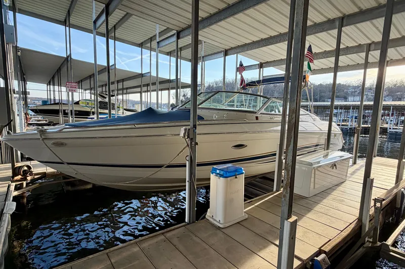 Slide: The Image of 2000 Formula 280 Bowrider docked in a covered marina, side view. - 2