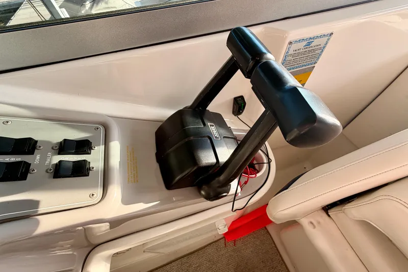 Slide: The Image of Throttle controls and switches on a 2000 Formula 280 Bowrider boat dashboard. - 21