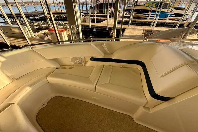 Slide: The Image of Interior view of a 2000 Formula 280 Bowrider boat with beige seating. - 26
