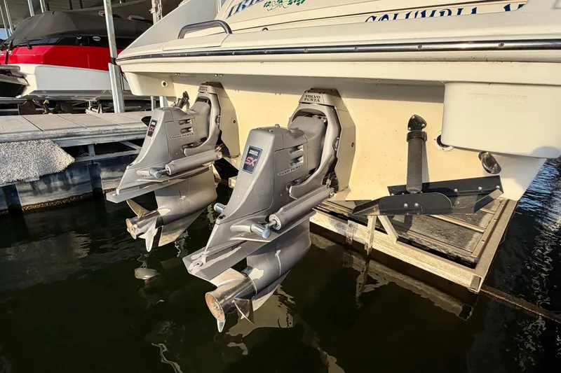 Slide: The Image of Dual Volvo Penta outdrives on a 2000 Formula 280 Bowrider boat at dock. - 5