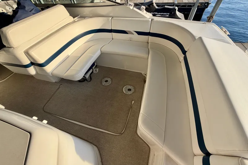 Slide: The Image of Spacious seating area on a 2000 Formula 280 Bowrider boat with beige upholstery. - 9