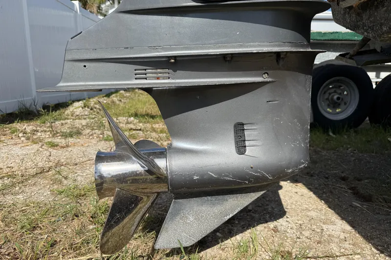 Slide: The Image of Close-up of a 2001 Parker 2510 Walkaround boat propeller and lower unit. - 16