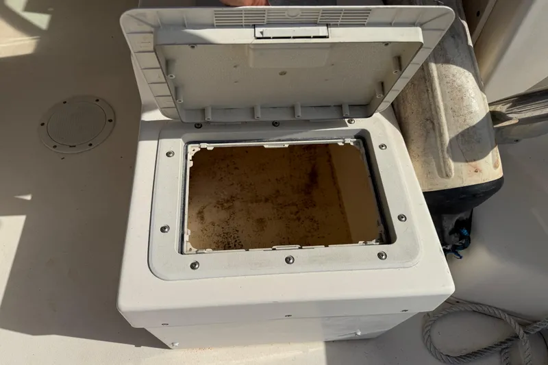 Slide: The Image of Open storage compartment on a 2001 Parker 2510 Walkaround boat deck. - 30