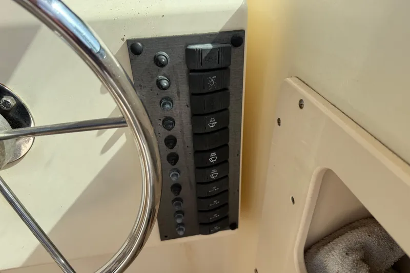 Slide: The Image of Control panel and steering wheel of a 2001 Parker 2510 Walkaround boat. - 35