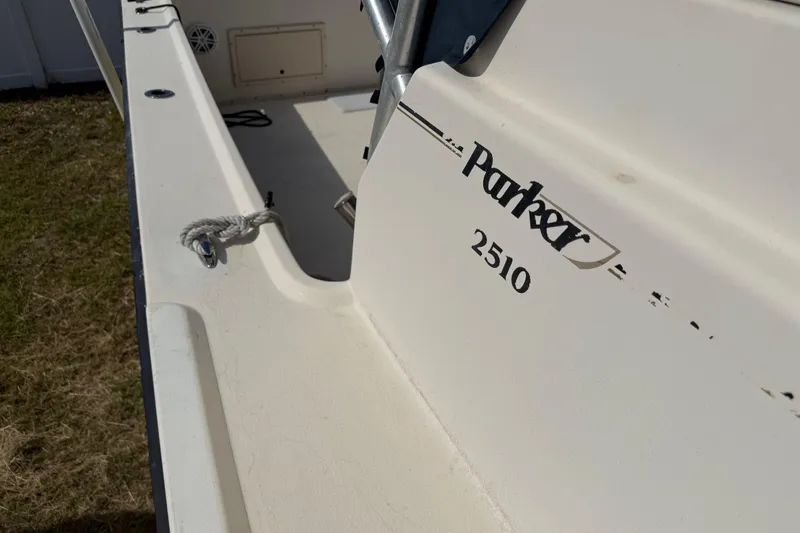 Slide: The Image of 2001 Parker 2510 Walkaround boat deck with visible branding and rope detail. - 41
