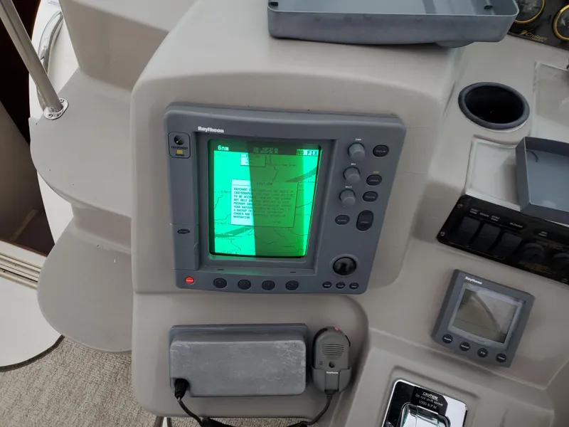 Slide: The Image of 2002 Cruisers Yachts 4270 Express navigation system and control panel. - 5