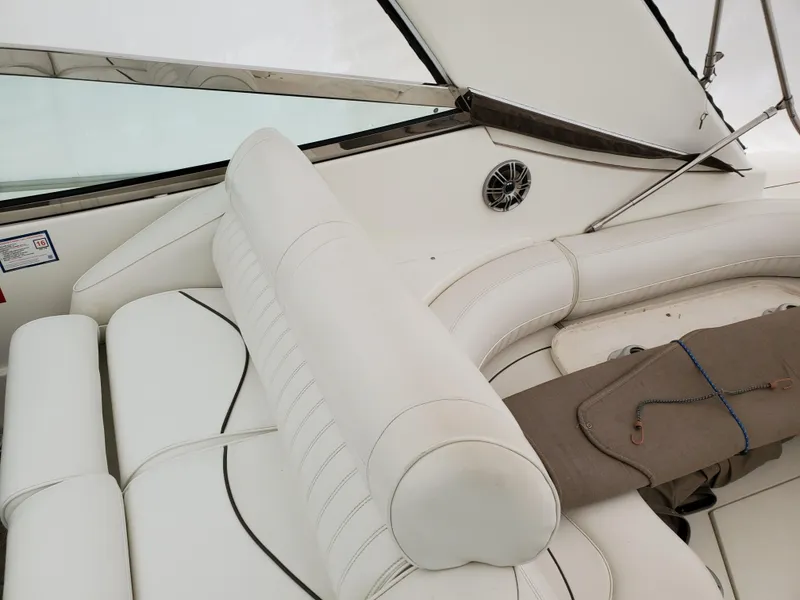 Slide: The Image of 2002 Cruisers Yachts 4270 Express white leather seating area. - 7