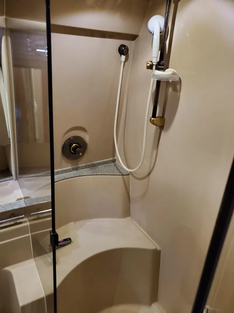 Slide: The Image of 2002 Cruisers Yachts 4270 Express shower with glass door and modern fixtures. - 9