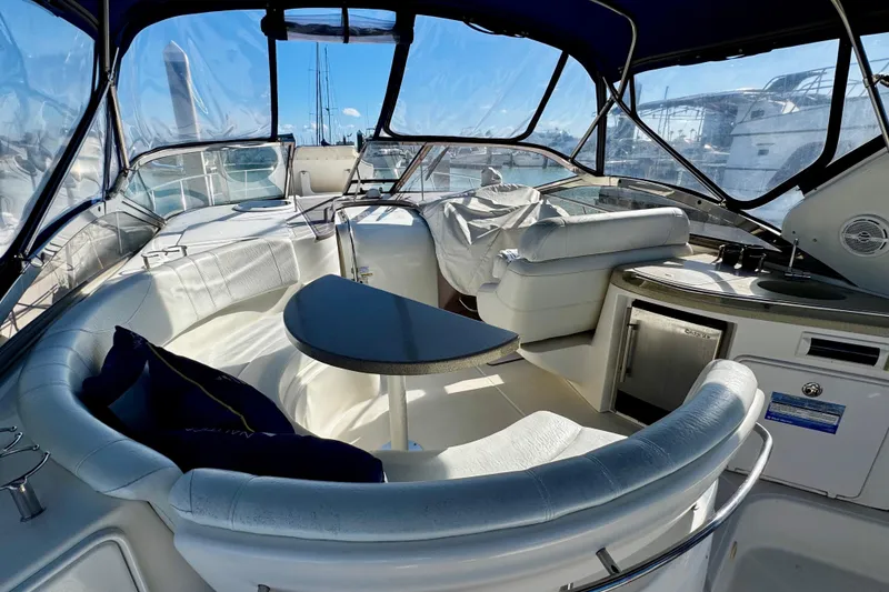 Slide: The Image of Luxurious 2004 Regal Commodore 3860 yacht interior with seating and kitchenette. - 15