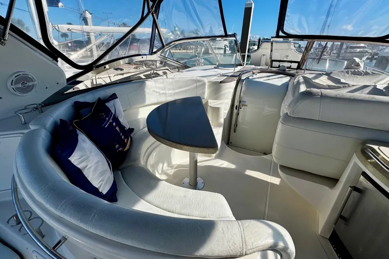 Slide: The Image of Luxurious interior of 2004 Regal Commodore 3860 yacht with plush seating and table. - 16