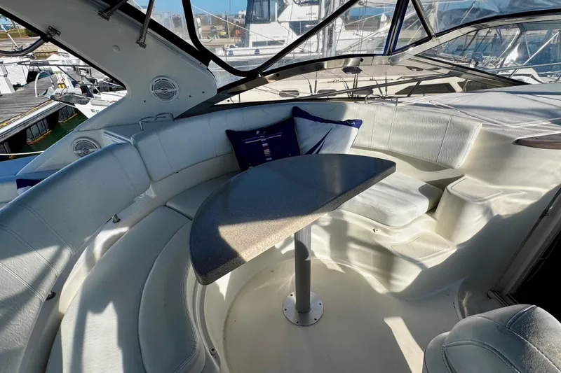 Slide: The Image of Luxurious 2004 Regal Commodore 3860 yacht interior with curved seating and table. - 17
