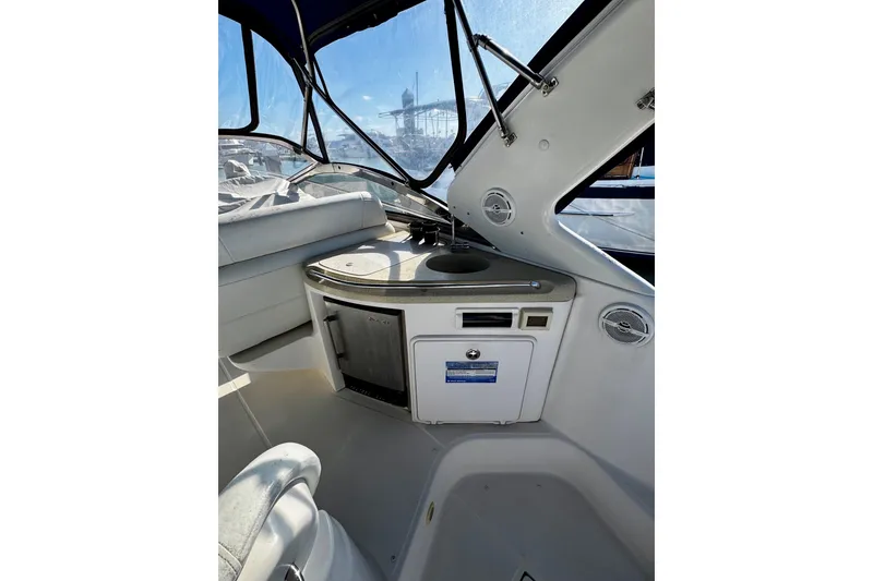 Slide: The Image of Interior view of 2004 Regal Commodore 3860 yacht with kitchenette and seating area. - 18